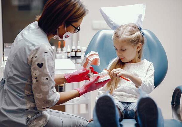 cute-little-girl-sitting-dentist-s-office